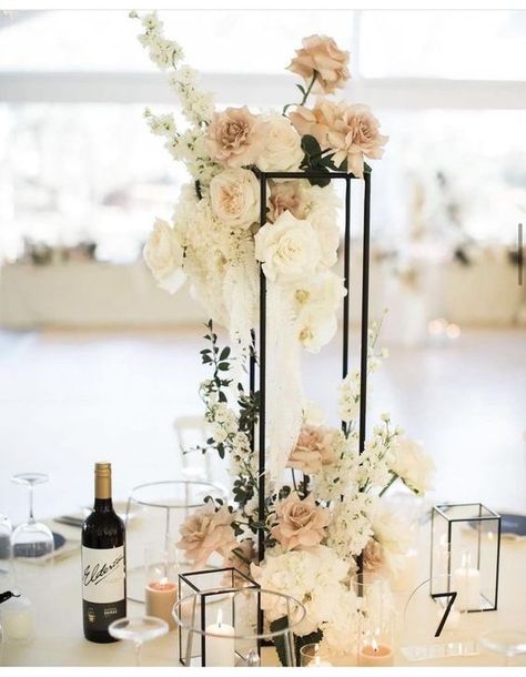 Monochromatic Wedding Centerpieces, Modern Tall Centerpieces Wedding, Gold Harlow Stand Centerpiece, Champagne Welcome Table Wedding, Elevated Floral Arrangements, High Centerpiece Wedding Romantic, Rectangle Wedding Centerpieces, Gala Centrepiece, Neutral Wedding Flowers Centerpieces