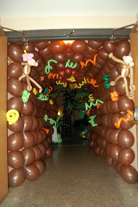 Jungle balloon tunnel Fun Hallway, Balloon Tunnel, Safari Vbs, Jungle Vbs, Vbs Jungle, Brown Balloons, Childrens Ministry Decor, Cave Quest, Weird Animals Vbs