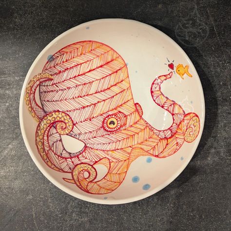 Hand-painted ceramic bowl featuring a vibrant red and orange octopus with intricate patterns, alongside a small playful fish. Marine Decor, Painted Pottery, Hand Painted Pottery, Ceramic Tray, Small Fish, Red And Orange, Ocean Lover, Ceramic Bowl, Pottery Painting