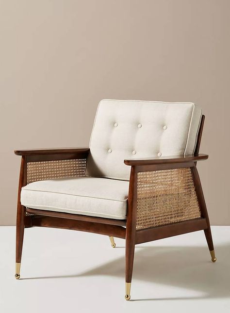 Walnut finish 'Nadia' caned armchair, £698 at Anthropologie. A very elegant chair by Anthropologie with its rich walnut veneer and brass accents, and those caned arms will never go out of style. [button url="https://www.anthropologie.com/en-gb/shop/nadia-caned-accent-chair?color=012&type=REGULAR&size=One%20Size&quantity=1"]Shop now[/button] Cane Webbing Chair, Designer Accent Chairs, Rope Chair, Hanging Furniture, Cane Furniture, Cane Chair, Anthropologie Uk, Furniture Hacks, Room Decorations