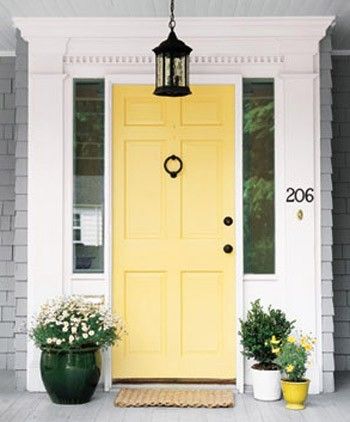 Like the yellow door for a light gray house.  Hmmmm, I have a lite gray house... and my favorite color is yellow... Hmmm  I wonder if this would be too much though.  It looks light and fresh here, I wonder if during the winter it would look just as good though.  I have shutters that I would paint to match as well as garage doors too. Hawthorne Yellow, Yellow Front Door, Front Door Inspiration, Yellow Front Doors, Front Door Paint Colors, Yellow Door, Door Paint Colors, Real Estat, Yellow Doors