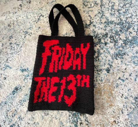 Friday the 13th Tote Bag  Handmade crochet bag that can be used for any occasion. This spooky bag is great for halloween or just a trip to the store. The handmade bag is perfect for all horror movie fanatics!  Dimensions: 11.5 inches wide x 14 inches tall  Total Length of Bag-22 inches (including strap)  *Dimensions my vary slightly with each bag*  Shipped from New York with a processing time of 5-7 days  What material is used?  Acrylic Yarn  This bag is not lined  Returns/Exchanges: Due to the Halloween Crochet Bag, Crochet Halloween Bag, Horror Movie Crochet, Scream Bag Crochet, Slasher Crochet Pattern, Crochet Jason Voorhees Pattern, Horror Tapestry Crochet, Movie Crochet, Crochet Horror