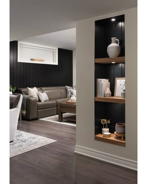 Black Niche Living Room, Black Shiplap Wall With Shelves, Basement Gym And Family Room Wall, Black Accent Wall In Basement, Black Wall Basement Ideas, Black Built In Shelves, Black Basement Walls, Basement Office Nook, Behind Bar Wall Ideas