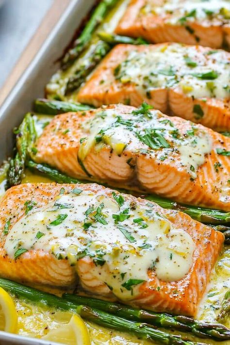 Baked Salmon with Asparagus, Lemon, Garlic and Butter Sauce Baked Salmon With Potatoes, Whole Salmon Filet Recipes Baked, Baked Salmon With Lemon Butter Sauce, Garlic Butter Salmon Baked, Salmon And Asparagus Baked, Meals With Asparagus, Salmon Meal Ideas, Fish With Asparagus, Baked Salmon With Asparagus