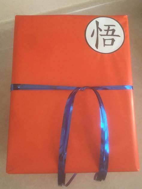 Dragon Ball Z wrapping, wrap & ribbon from dollar store. Dragon Ball Valentine, Dragon Ball Z Diy Crafts, Dragon Ball Bday Party, Diy Dragon Ball Z Gifts, Dragon Ball Z Valentine Box Ideas, Dragon Ball Z Gift Ideas, Dragon Ball Gifts For Boyfriend, Dragon Ball Gifts, Dragon Ball Z Gifts For Boyfriend