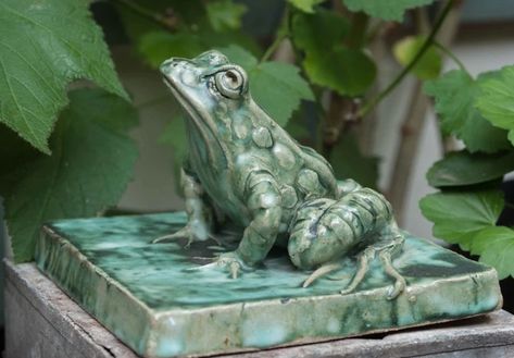 This little chap is one of my favourites. Each one is individual and this one has a 'don't bother me' attitude! he sits on a tile measuring 18 x 18cm and is made of ceramic, glazed in my markble green glaze. Frog on Tile is from my Ceramic Collection and can also be made with a water spout if desired. Frog Statues, Ceramic Frogs, Back Garden Design, Bird Bath Garden, Faux Flower Arrangements, Pottery Handbuilding, Frog Art, Wall Fountain, Small Sculptures