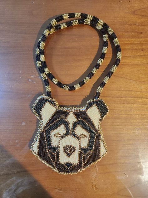 This is a brown and gold geometric bear medallion with a peyote stitch strap. Beaded Bear Paw Medallion, Beaded Bear Medallion, Bear Medallion, Beaded Bear, Bead Applique, Cross Applique, Beading Designs, Geometric Bear, Native American Crafts