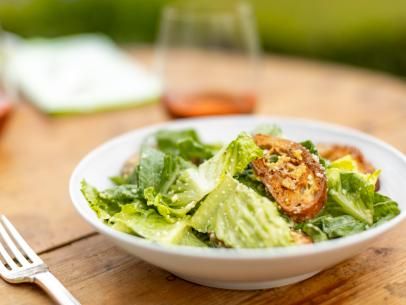 Caesar Salad with Parmesan Croutons Recipe | Ina Garten | Food Network Caesar Salad Croutons, Salad Croutons, Parmesan Croutons, Croutons Recipe, Crouton Recipes, Be My Guest, Ina Garten Recipes, Caesar Salad Dressing, Romaine Lettuce Salad