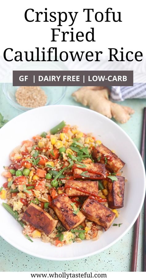 a white bowl with cauliflower fried rice with veggies and crispy tofu on top on light aqua background with sesame seeds, ginger and dark chopsticks around Tofu Ideas, Tofu Cauliflower, Tofu Green Beans, Fried Cauliflower Rice, Tasteful Recipes, Meatless Mains, Frozen Cauliflower, Cauliflower Fried, Firm Tofu