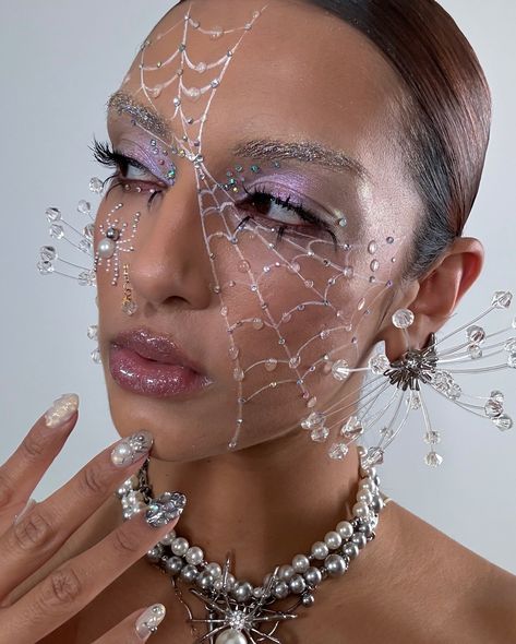 Web of tears and gems 💎 💧 ✨ if you’re looking for a really easy Halloween look, this is the one 🕷️ 🕸️ IB @lynda.florae and @meicrosoft Using @embellishbyrowi Studs, Rhinestones and Pearls to bring this look to life! And also @glisten_cosmetics wet liner in milk @kaleidosmakeup space cadet @danessamyricksbeauty lightwork volume 6 palette @jessmaasbeauty lashes @isamayabeauty gloss Earrings by @hugokreit Gem Makeup Looks Halloween, Pearl Skeleton Makeup, Diamond Halloween Makeup, Spider Rhinestone Makeup, Gem Eye Makeup, Eye Makeup Halloween, Editorial Silver Makeup, Pearl Makeup Looks Editorial, Glisten Cosmetics