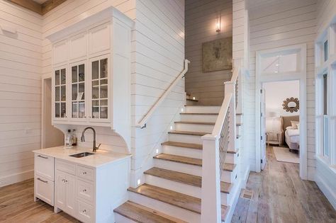 Beach Bungalow wet bar features white shaker cabinets adorned with nickel pulls and glass knobs topped with white marble fitted with a dark… Beach Bungalow, Beach Bungalows, Kitchen Design Decor, House Stairs, Pictures Ideas, Ship Lap Walls, House Goals, Wet Bar, Basement Remodeling