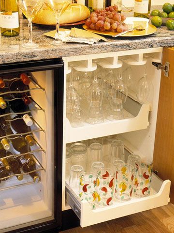 Cabinets devoted to holding stemware save you from storing the less-used items in the main-level kitchen. Pull-out drawers in the cabinets ensure that every inch of storage space is easily accessed. Wine Glass Drawer Storage, Wine Glass Storage In Drawers, Wine Glass Drawer, Wine Glass Storage Ideas, Bar Glass Storage, Additional Kitchen Storage, Inside Cabinet, Basement Conversion, Wine Glass Storage