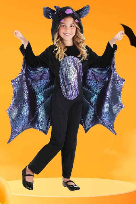 The soft jumpsuit fastens at the side and is made of black minky fabric. An oval-shaped inset sewn over the torso is printed with a shiny purple scale pattern. Long, wing-shaped drapes made of the same scale-patterned material are attached to the sleeves. Each one has a reverse-scalloped edge and stitchwork that resembles bat wing fingers. #bat_costumes #halloween_costumes Kids Bat Costume, Clean Fruit, Top 10 Halloween Costumes, Bat Hanging, Scary Bat, Halloween Costumes To Make, Bat Costume, Fruit Bat, Animal Costumes