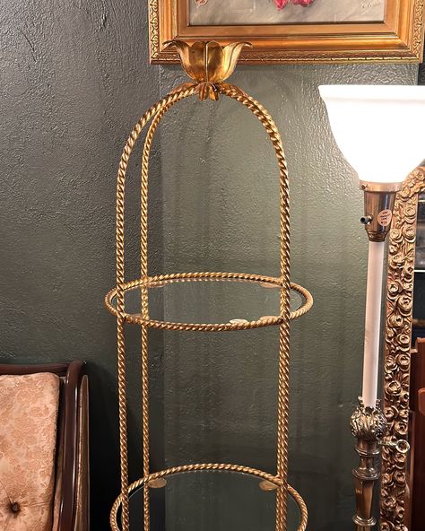 𝐒𝐎𝐋𝐃— Vintage Gold Wrought Iron Round 3 Tier Etagere. A gorgeous, French style etagere in desperate need of plants & a candle.🕯️ It features a twisted, wrought iron frame with a gold finish, 3 glass shelves and a sculpted flower cup at the top which would make the perfect match or candle accessory holder! In very good condition with minor finish wear due to age. One of the glass pieces has a chip (see photos). 13” wide shelves x 24” wide base x 57” tall $225 This piece can be seen in st... Gold Etagere, Wide Shelves, Accessory Holder, Tiered Garden, Flower Cup, Accessories Holder, Glass Pieces, Candle Accessories, Plant Needs