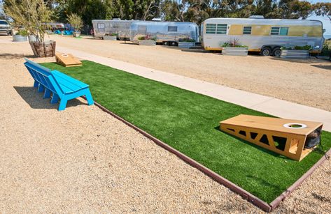 Cornhole Area Backyard, Backyard Yard Game Area, Outdoor Corn Hole Area, Corn Hole Court Backyard Ideas, Corn Hole Area In Backyard, Corn Hole Backyard Set Up, Campground Playground Ideas, Cornhole Playing Area, Cornhole Pit Backyard