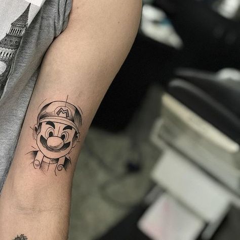 Nesse destaque da semana do Tattoo2me o assunto é: TROCAR! Tattoo Sleeve Minimalist, Super Mario Tattoo Ideas, Gaming Tattoo Sleeve, Xbox Tattoo, Tattoos Pokemon, Playstation Tattoo, Super Mario Tattoo, Tattoo Games, Xbox Design