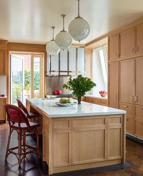 Peter Pennoyer Architects on Instagram: "The oak clad kitchen for a triplex in an historic downtown building includes a custom range hood with textured art glass and a polished nickel frame and a granite base beneath the island. Interior design: @katieridderinc; photo: @ericpiasecki #peterpennoyerarchitects #moderntraditional #kitchen" Warm Toned Kitchen, Midcentury Modern Kitchen, All Things Fall, Kitchen Inspiration Design, Kitchen Trends, New Home Construction, Fall Home, Wooden Kitchen, Wood Kitchen