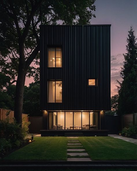 Be captivated by the allure of this stylish matte black factory-built small house at dusk 🏠🌌. Warm lights glow from within, creating a striking contrast with the sleek, textured exterior and large windows. The modern garden and twilight sky complete this luxurious architectural masterpiece 🌿✨. Did someone say 'dream house goals' or is it just me? 😍 #MatteBlack #ModernHome #SmallHouse #LuxuryLiving #ArchitecturalPhotography #ModernDesign #Dusk #WarmLighting #CleanLines #HighResolution #HomeI... Black Lifestyle, Twilight Sky, Factory Building, Is It Just Me, House Goals, Modern Garden, Large Windows, Architecture Photography, Warm Light