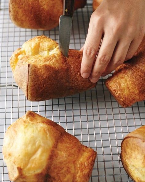 Popovers lose their crunch if they linger in the pan, so turn them out on a wire rack immediately and poke a small opening in the side of each with a paring knife to let the steam escape. Serve right away. Try all of our popover variations: Gruyere-Thyme Popovers, Dark Chocolate Popovers, Chive Popovers, Cinnamon Sugar Popovers, Bacon and Black Pepper Popovers, and Orange Popovers. Perfect Popovers, Popovers Recipe, Pop Overs, Mac And Cheese Cups, Muffin Pan Recipes, Popover Pan, Popover Recipe, Yorkshire Puddings, Tin Recipes