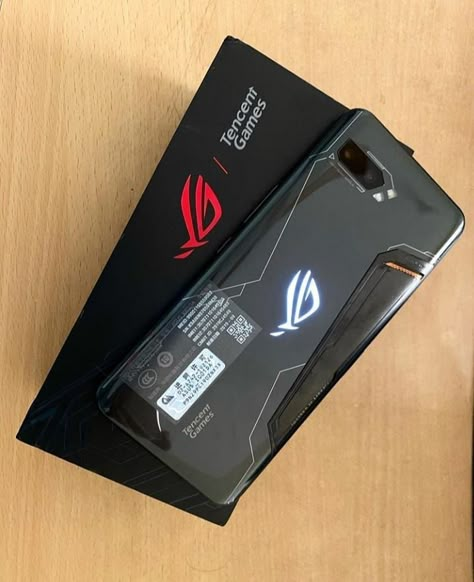 The ASUS ROG Phone II is tailor-made for Android gamers and considered "the ultimate gaming phone. The latest ASUS ROG phone also packs customizable, touch-sensitive controls with haptic feedback, dubbed AirTrigger II. Read more in BESTECH: http://tiny.cc/bfqdsz  📷(cek_tokokita) #asusrogphone2 #asusrogphoneII Asus Rog Phone 7 Ultimate, Logo Design Inspiration Sports, Hp Gaming, Augmented Reality Games, Gaming Phone, Peaky Blinders Characters, Rog Phone, Video Game Room Design, Phone 7