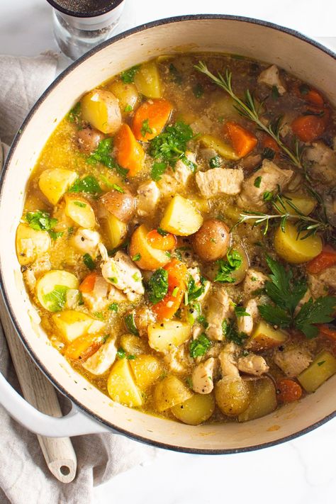 This quick and easy one-pot Chicken Stew is made with chicken, potatoes, and carrots simmered in a deliciously seasoned broth and garnished with fresh herbs. Enjoy with crusty bread for a savory and comforting meal! Chicken Potatoes And Carrots, Easy Stew Recipes, Panini Recipes Chicken, Dutch Oven Chicken, Chicken Tikka Masala Recipes, Stew Chicken Recipe, Stewed Potatoes, One Pot Chicken, Carrots And Potatoes