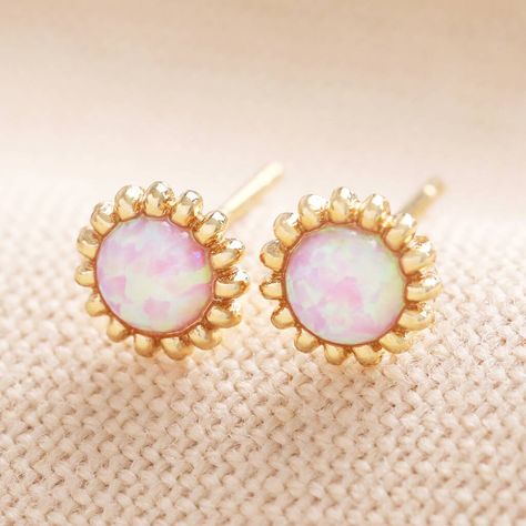 The cutest pair of pink opal studs encased in dotted silver or gold plating.These pretty-in-pink floral studs are ideal for adding a summer feel to your wardrobe.
Made of either 14ct gold plating or sterling silver plating, these sweet studs feature a scalloped edge with a stunning opalite stone in the centre. The iridescent pink glitters in the light, boasting colours of green, purple, blue and white.
The posts are made of hypoallergenic sterling silver, making them a great option for sensitive ears to wear all-day long. Simply secure via the butterfly pushbacks.14ct gold plated brass, sterling silver plated brass, pink opalite, sterling silver postsChoose from gold or silver.width 6mm x height 6mm x depth 2mm Tiny Gold Studs, Lisa Angel, Everyday Jewellery, Floral Studs, Mini Studs, Ceramic Cat, Semi Precious Gems, Opal Studs, Flower Stud Earrings