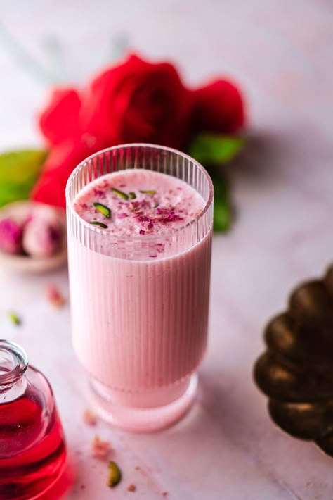 Rose Lassi is perfect for a romantic date night. This lassi is flavored with roses and cardamom and makes a delicious vibrant pink drink. Ramadan Drinks Recipes, Lassi Photography, Indian High Tea, Rose Lassi, Ramadan Drinks, Rose Drinks, Masala Pasta, Strawberry Lassi, Lassi Recipe