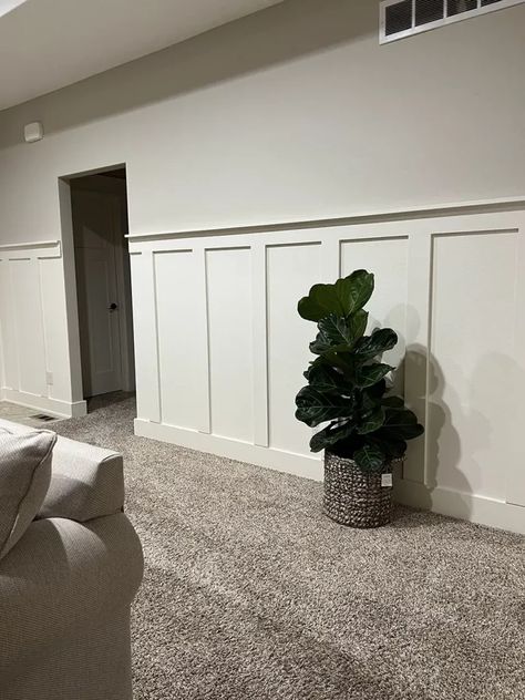 Board and batten wall is painted and complete. Board And Batten Wall Neutral, Living Room Batten Wall, Board And Batten Living Room, Hall Panelling, Cathedral Ceiling Living Room, Wall In The Living Room, Custom Wall Design, Flip Houses, Piano Wall