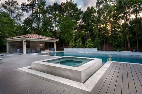 Poolside Luxury with Regal Pools | Trex Pool With Trex Decking, Trex Pool Deck, Trex Pool Deck Ideas, Trek Deck, Decks Around Pools, Backyard Renovation, Rectangle Pool, Sloped Yard, Pool Photography