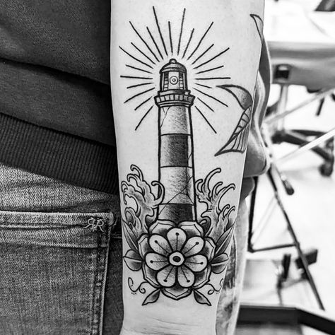 Lighthouse tattoo with waves &flower 🌊🌺 Lighthouse And Flowers Tattoo, Montauk Lighthouse Tattoo, American Traditional Lighthouse Tattoo, Light House Tattoo, Tattoo Lighthouse, Traditional Lighthouse Tattoo, Montauk Lighthouse, Traditional Tattoo Flash Art, House Tattoo