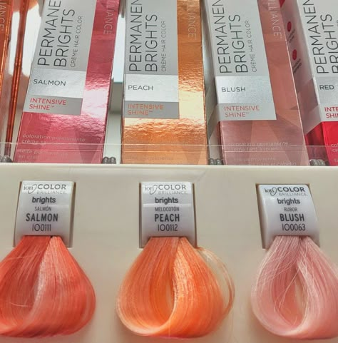 Image of hair swatches at beauty store vsco filter pink, salmon, peach, rose Pastel Peach Hair Dark Roots, Golden Melon Hair Color, Bright Peach Hair, Pastel Peach Hair Color, Watermelon Pink Hair, Peachy Coral Hair, Peach Coral Hair, Salmon Hair Color Peach, Cute Hair Colors For Brunettes Dyes