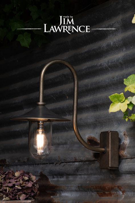 Bring a beautiful designer touch to your outdoor lighting scheme with our striking, swan necked Granary Wall Light that looks wonderful brightening any front door, exterior wall or outbuilding. Hand crafted from solid brass, it is a reimagined version of our popular Stable Wall Light with the addition of a brass cap and high arching arm to give it a more traditional look. Exterior Barn Lights, Lights Porch, Front Door Exterior, Electric Garden, Garden Lighting Ideas, Cottage Outdoor, Garden At Night, Natural Building Materials, Outside Lights