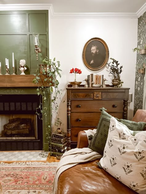 Green Vintage Aesthetic Room, What To Put On Side Of Fireplace, Toile Interior Design, Dark Green Antique Bedroom, Moody Green Living Room Walls, Green Living Room Farmhouse, Light Moody Decor, Anthropologie Interior Design, Moody Fireplace Decor