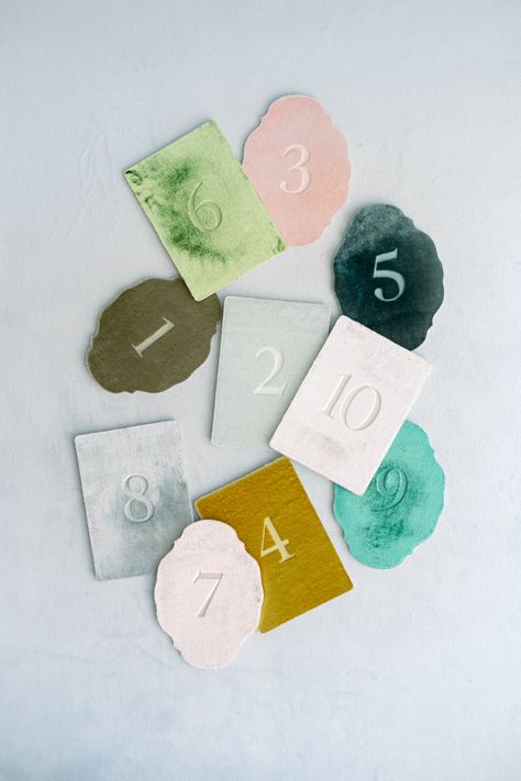 This is a beautiful silk velvet greeting card cut into an oval shape, featuring number printed on it using letterpress printing. The paper has a sturdy thickness of 2mm, utilizing environmentally friendly recycled cardboard. The backside is white, allowing you to write your own message.  [Contents] Card + Envelope, 1 of each (plain backside) *Stand, flowers, ribbons, etc., are not included with the product. [Card Size] 148 × 108mm (5.9 × 4.3 inches) [Envelope Size] 162 × 114mm (6.4 × 4.5 inches)   [This product is accepted as a custom order] Regarding the color you desire, you are generally allowed to choose from what we have in stock in plain colors. We will start making your order after we receive it, so please allow approximately one week from order to delivery. If you order other prod Velvet Table Numbers, Letters To Guests Wedding, Greeting Board, Unique Table Numbers Wedding, Name Place Cards Wedding, Placement Cards, Table Labels, Product Card, Name Place Cards