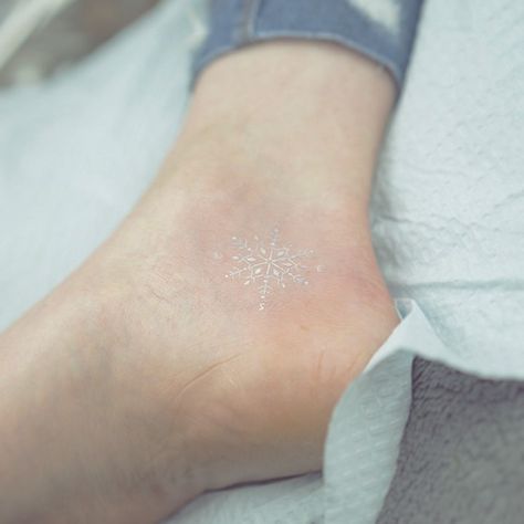 Tiny Foot Tattoo Tiny Foot Tattoos, Snowflake Tattoo, Snow Flake Tattoo, White Ink Tattoo, Clever Tattoos, Small Tattoos For Guys, White Tattoo, Foot Tattoo, Ankle Tattoo