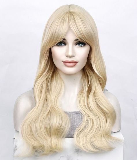 Introducing the Barbie Synthetic Wig, a dazzling creation that brings the iconic Barbie style to life. This glamorous wig is designed for those who want to embody the timeless charm and elegance of Barbie herself. Color: Barbie Blonde is the epitome of blonde perfection. This shade captures the essence of Barbie's signature hair color, radiating a soft and luxurious blonde hue that's both captivating and enchanting. Style: This wig features the classic Barbie style with bangs, offering a timeless and sophisticated appearance. The bangs frame your face beautifully, accentuating your features and adding a touch of playful charm to your overall look. Texture: The Barbie wig boasts a natural wavy texture that exudes effortless glamour. Cap Construction: Our Barbie wig features a machine-made c Barbie Wig, Barbie Blonde, Classic Barbie, Barbie Style, Wig With Bangs, Synthetic Wig, Wigs With Bangs, Synthetic Wigs, Barbie Fashion