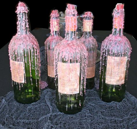 Dripped Wax Wine Bottles for Halloween - Easy DIY - Adorn the Table Candle Wax Dripping Wine Bottles Diy, Non Flower Centerpieces, Candle Dripping, Patio Table Centerpiece, Drippy Candles, Melted Wine Bottles, Simple Centerpieces Diy, Pink Candle, Drawing Help