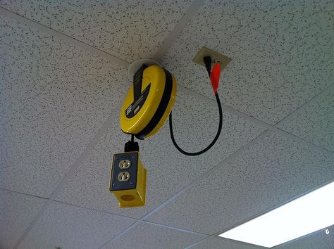 Ceiling electrical outlets for use over tables so people don't have to go to the room's perimeter counter tops to use things like glue guns, hairdryers/heat guns, etc. that require an outlet. Hide Electrical Cords, Ceiling Outlet, Electric Outlets, Tool Roll, Sewing Room Organization, Industrial Table, Classroom Design, Miter Saw, Garage Design