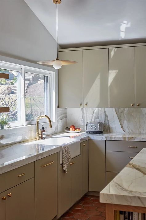 Green gold marble counters and tiled flooring. Sink With Brass Faucet, Old Spanish Style Homes, Homes Design Ideas, Saltillo Tile Floor, Spanish Homes, Glass Shower Panels, Emily Henderson Design, Marble Counters, 70s Home