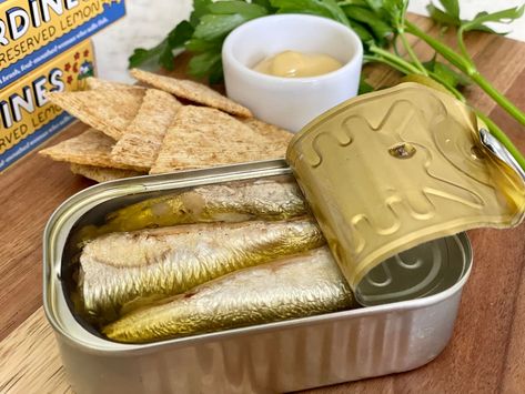 In Spain and Portugal, it's common to eat these tinned-fish conservas in a bar as snacks with drinks. And, they are having a moment in the USA in restaurants and at home. Sardines On Crackers, Snacks With Drinks, Ginger Ice Cream, Tinned Fish, Moroccan Cooking, Gourmet Food Store, Preserved Lemons, Smoked Fish, Nyc Restaurants