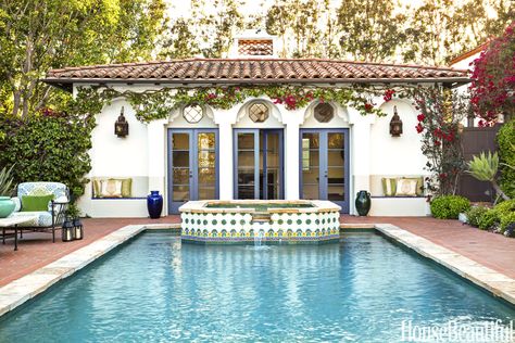 The tiles on a raised Jacuzzi create a focal point at the end of the pool. French doors open to the poolhouse. Colonial Revival House, Boho Glam Home, Spanish Colonial Homes, Spanish Revival Home, Spanish Bungalow, Colonial Style Homes, Mediterranean Home Decor, Spanish Style Home, Casas Coloniales