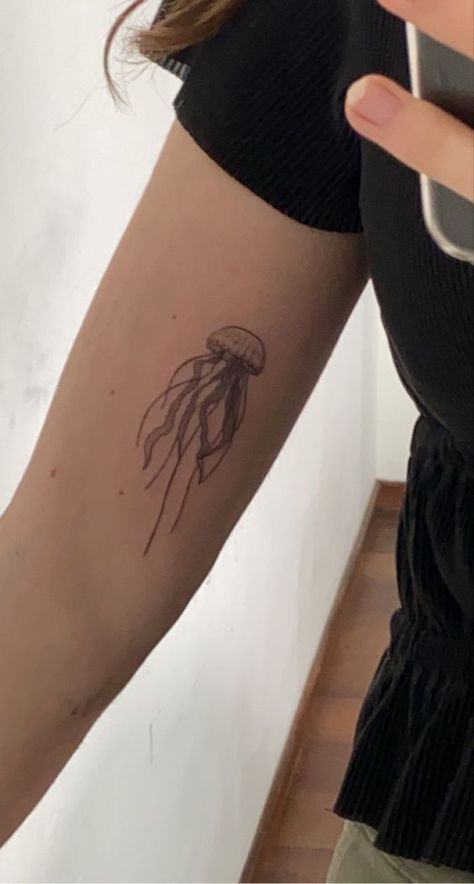 Discover the art of transformation with jellyfish tattoos in our article. Explore it and find 50+ stylish designs with meanings explained. Aesthetic Jellyfish Tattoo, Jellyfish Tattoo Aesthetic, Stick And Poke Jellyfish, Flower Jellyfish Tattoo, Matching Jellyfish Tattoos, Jellyfish Tattoo Back, Tiny Jellyfish Tattoo, Jelly Fish Tattoo Simple, Cute Jellyfish Tattoo