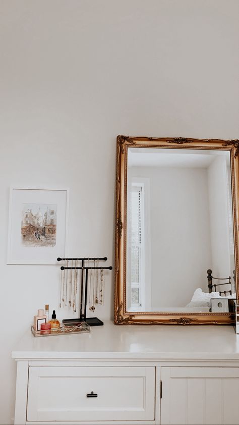 Bedroom Dresser Vanity, Gold Mirror On Dresser, Jewelry On Dresser Top, Feminine Dresser Decor, Mirror On Dresser Leaning, Gold Mirror Above Dresser, White With Gold Accents Bedroom, Jewelry Display On Dresser, Gold Accent Bedroom Ideas