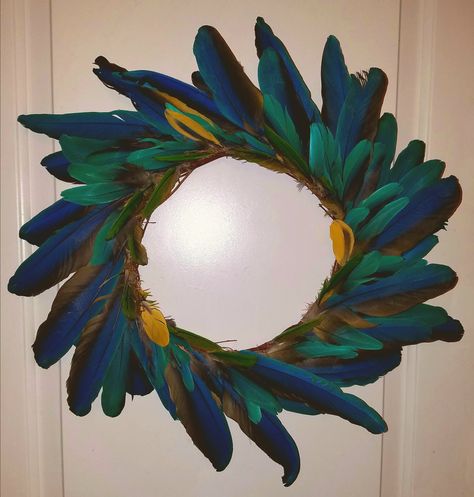 Handmade wreath from molted pet bird feathers Parrot Feather, Feather Wreath, Native Artwork, Feather Decor, Wreath Wall, Feather Crafts, Pet Bird, Peacock Feathers, Handmade Wreaths