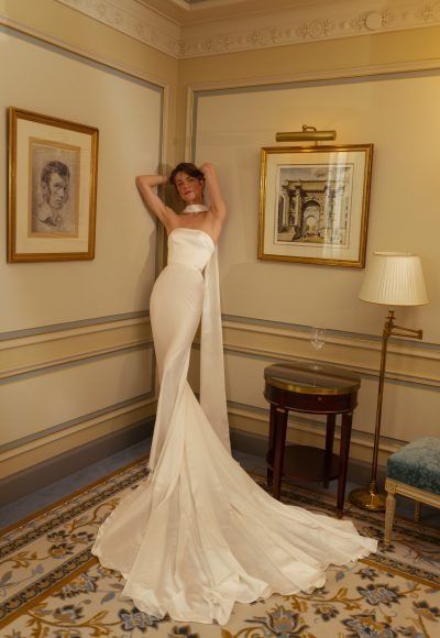 Minimalist Wedding Dresses - Simple Yet Stunning | Kleinfeld Bridal Vintage Silk Wedding Dress Classy, Simple Elegant Wedding Dress Strapless, Minimalist Silk Wedding Dress, Classic Strapless Wedding Dress Simple, Minimal Wedding Dress Minimalist, Minimalist Wedding Gown Classy, Minimal Strapless Wedding Dress, Chic Strapless Satin Wedding Dress, Simple Minimalist Wedding Dress