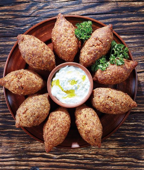 Cold potato kibbeh or kibbeh b joz (walnut kibbeh) is an easy vegetarian type of kibbeh and is served as a side. From the Food Heritage Foundation. Kibbeh Recipe, Yogurt Dipping Sauce, Meatball Dishes, Appetizer Platters, Lebanese Recipes, Best Chef, Easy Vegetarian, How To Make Homemade, Cooking Tools