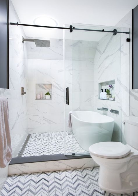 A second-floor hall bath has a wet room with a soaking tub on one side and shower on the other. It is separated from the toilet and vanity by a glass frameless shower door. A newly installed sky tunnel window brings tons of light into a previously windowless space. The toilet was moved and shelving now frames the vanity, not visible in the photo, to the right of the toilet. Shower Tub Toilet Room, Bathroom Jacuzzi Tub Ideas Glass Showers, Shower And Bath Side By Side, Bath Shower Side By Side, Small Toilet Design With Bath Tub, Soaking Tub In Shower Walk In, Super Shower Bathroom, Tube Inside Shower Ideas, Luxury Bathtub Shower Combo