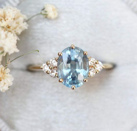 Josephine ring - https://www.capucinne.com/products/oval-blue-sapphire-engagement-ring-sapphire-diamond-engagement-ring-4971?variant=30183126040620 18k yellow gold, US 5.5; appraisal Total $3720 split in three payments Engagement Ring With Blue, Oval Engagement Ring With Round Side Stones, Blue Diamond Engagement Ring Vintage, Blue Oval Engagement Ring, Wedding Rings Blue Diamond, Blue Stone Engagement Ring, Blue Diamond Wedding Ring, Light Blue Sapphire, Vintage Inspired Engagement Rings