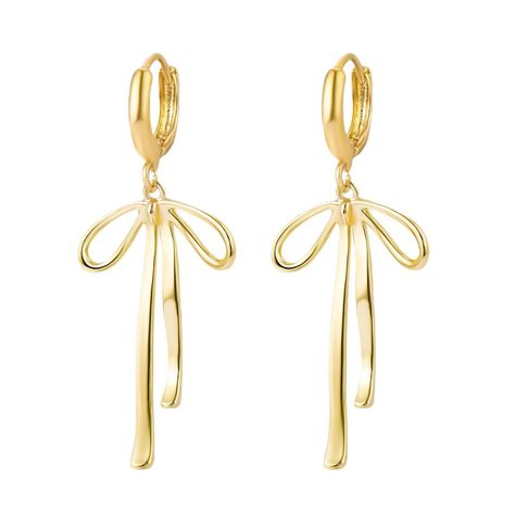 PRICES MAY VARY. Gold Bow Earrings: Elevate Your Style with These Exquisite Gold Bow Earrings, A Perfect Blend of Sophistication and Charm. Crafted to Perfection, These Earrings Exude Timeless Elegance, Making Them a Must-Have Accessory for Any Occasion. Bow Earrings Gold: Embrace Versatility with These Stunning Bow Earrings in Gold. Whether You're Heading to a Casual Outing or a Glamorous Event, These Earrings Effortlessly Complement Any Outfit, Adding a Touch of Allure and Grace to Your Look. Hoco Earrings, Candle Earrings, Ribbon Tassel, Ribbon Earrings, Long Bow, Earrings Trendy, Bow Ribbon, Inspo Board, Silver Bow