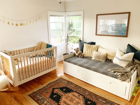 This bed from ikea folds out into a king & has two huge storage drawers. YAASS. Crib With Bed In Room, Dual Nursery And Guest Room, Nursery With Bed And Crib Layout, Nursery With Fold Out Bed, Nursery With Twin Bed And Crib, Baby Nursery With Guest Bed, Nursery With Bed And Crib, Nursery Ideas With Day Bed, Baby Room With Daybed